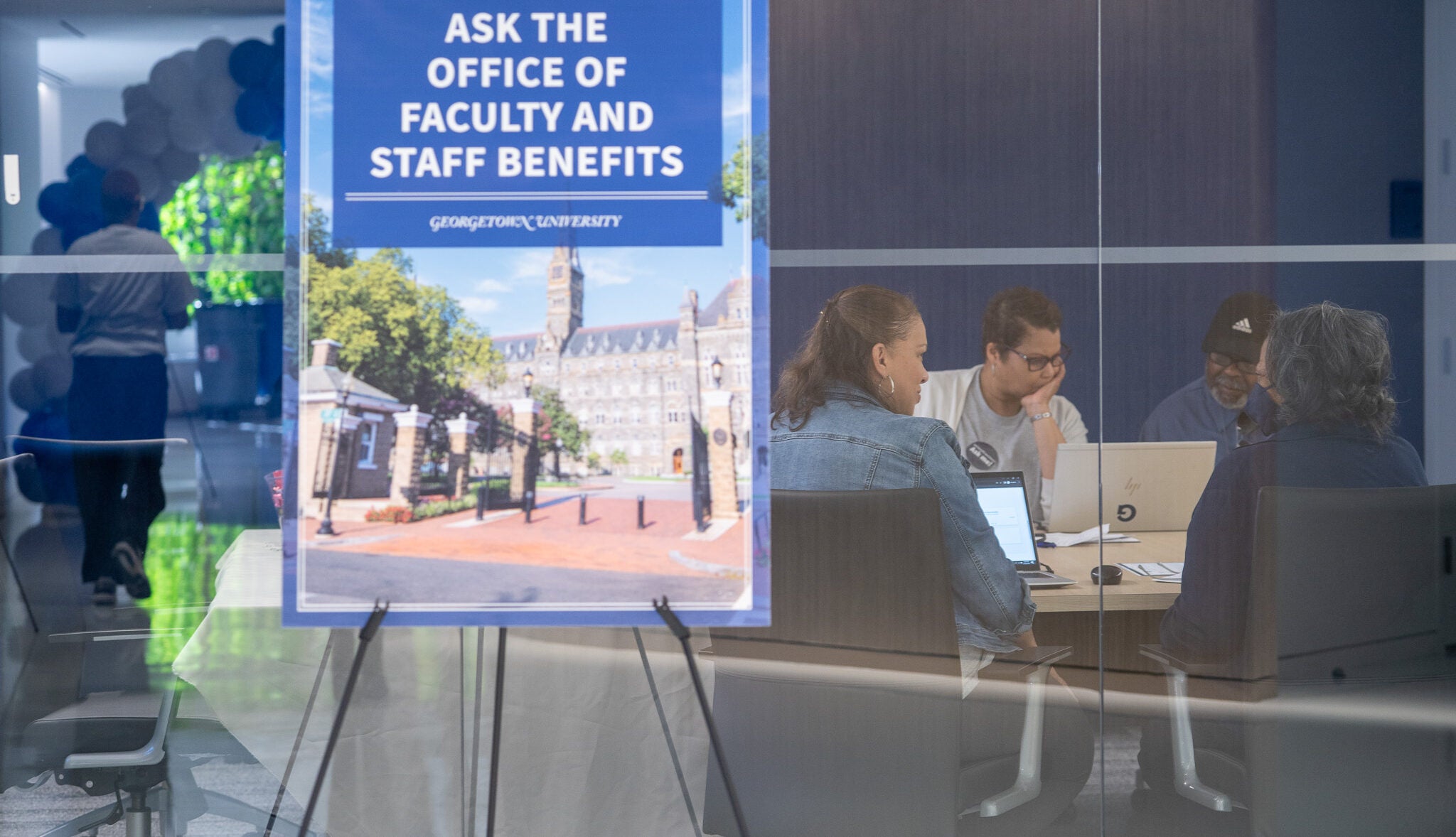 benefits team sitting in a conference room